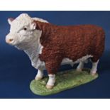 A Harper Shebeg Isle Of Man studio pottery matt glazed model of a Hereford bull with painted mark to