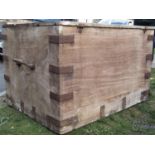 A substantial 19th century teak box/chest with hinged lid, exposed dovetail construction, steel