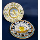 A 19th century Italian maiolica plate with painted decoration of a cherub within a decorated