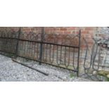 A run (three sections) of iron railing with decorative repeating interlaced strapwork design,