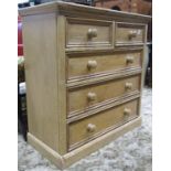 A stripped and waxed pine bedroom chest of two short over three long drawers set on a plinth, 95