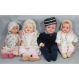 4 composition head character baby dolls including Canadian 'A Reliable Doll' with blue closing eyes,