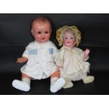 2 Armand Marseille baby dolls both with a 5 piece bent limb composition body, including a bisque