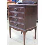 An Edwardian walnut sheet music cabinet of four long drawers with anodised handles and patent fall