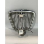 Motoring lot to include a Wolseley chrome car grille and a Smiths car clock (2)