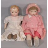 2 large 1920's dolls each with a composition shoulder- head, composition lower limbs and cloth body.