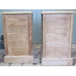 A pair of stripped pine pedestal chests, each fitted with six drawers, beneath an inset coloured and