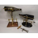 Two brass wine bottle cradles with wind up mechanism together with a mechanical antique corkscrew (