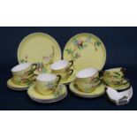 A collection of 19th century yellow ground tea wares with relief rose decoration, pattern 9542,