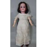 Circa 1920 bisque head doll made in Germany by Adolf Wislizenus, with blue closing eyes, open