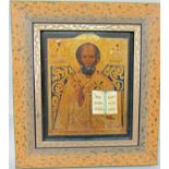 An eastern European icon with three quarter length painted and gilded study of a saint, 30 x 25cm in