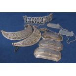 A collection of silver white metal decanter labels to include three sterling silver labels for