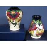 Two boxed Moorcroft cream ground vase in the Anna Lily pattern, both dated 98 to base and with