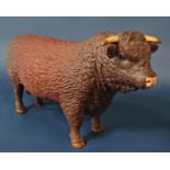 A Harper Shebeg Isle Of Man studio pottery matt glazed model of a Devon bull with reddish brown