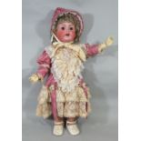 Large bisque head character doll by Kestner with brown closing eyes, open mouth with 2 teeth and