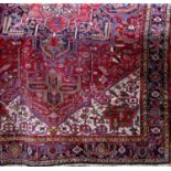 Good quality Persian country house carpet with various coloured medallions inset in side a cream