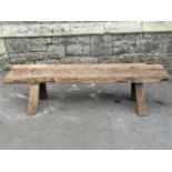 A rustic oak and pine pig bench with through jointed and tapered supports (af) 148cm long x 36cm