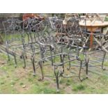 A set of six (4&2) contemporary ironwork garden chairs with shield shaped open scrolled back and