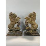 A pair of good polychrome cast iron door porters in the form of rampant lions holding a Union