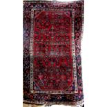 A Persian Tabriz type rug with geometric decoration upon a red ground, 155 x 100cm