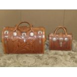 Two Heritage Collection American West stitched leather and embossed handbags with belt buckle straps