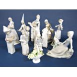 A collection of Lladro and Lladro Daisa figures including a girl holding a lamb, a girl with geese