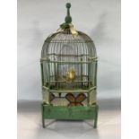 Taxidermy interest - a canary in an antique green painted bird cage 55cm high