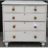 A Victorian pine bedroom chest of two short over three long graduated drawers raised on simple