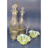 A three bottle silver plated cruet, the plated stand cast with berry and leaf decoration together