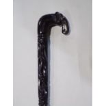 A good tribal walking stick with elephant head crook handle