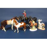 A collection of ceramic models of horses comprising a Beswick skewbald pony (af), a Beswick mat