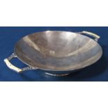 1930s Art and Crafts style twin handled pedestal dish, with hammered finish and pierced foot rim,