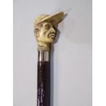 Ebonised walking stick with jockey head knop