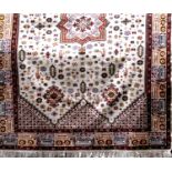 Good quality Berber carpet with central orange medallion and further still-lifes upon an ivory
