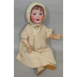 German bisque head character doll 1920's/30's with fixed blue eyes, open mouth with 2 teeth, short