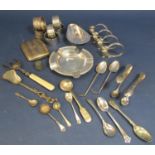 A mixed collection of silver and plate comprising napkin rings, ashtray, sugar tongs, etc