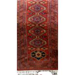 Belgian wool runner with central geometric medallion decoration upon a burnt orange ground, 275 x