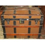 A late 19th century travel trunk with canvas timber lathe finish, with further metal fittings (