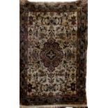 Pretty Persian carpet with pastel floral medallion upon an ivory ground, 140 x 80cm (af)