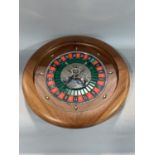 A leather cased roulette wheel, the case inscribed 'Dal Negro', to include chips