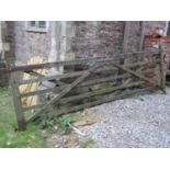 A weathered soft wood five bar field/entrance gate, 3.61 metres long (length excluding hinges x