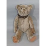 Vintage Teddy bear, possibly American with long limbs, felt paws, pronounced upturned snout with