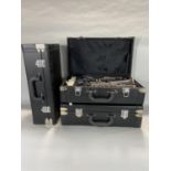 Three cased clarinets