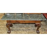 An occasional table with claw and ball supports with marble top