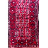 Good Turkoman runner with geometric decoration on a red ground, 220 x 95cm