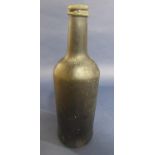 An early glass bottle, 28 cm high