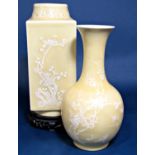 An oriental yellow ground vase with painted pate-sur-pate prunus blossom detail of four sided form