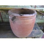 A large mat glazed garden planter of circular/cylindrical form with moulded rim, approx 60cm in
