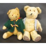 2 vintage teddy bears both with glass eyes, stitched nose and firmly stuffed, jointed bodies.