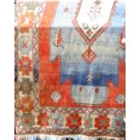 Good quality Turkoman rug with three square medallions and further geometric still-lifes, upon a